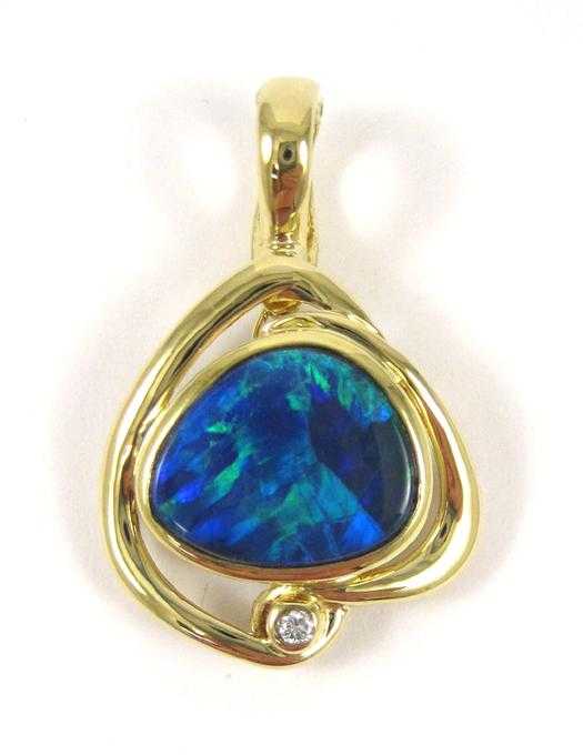 Appraisal: OPAL DOUBLET AND EIGHTEEN KARAT GOLD PENDANT set with a