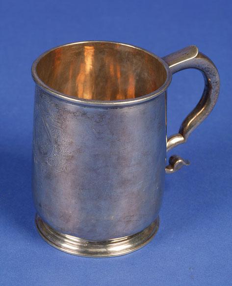 Appraisal: A GEORGE I MUG of circular form with a scroll