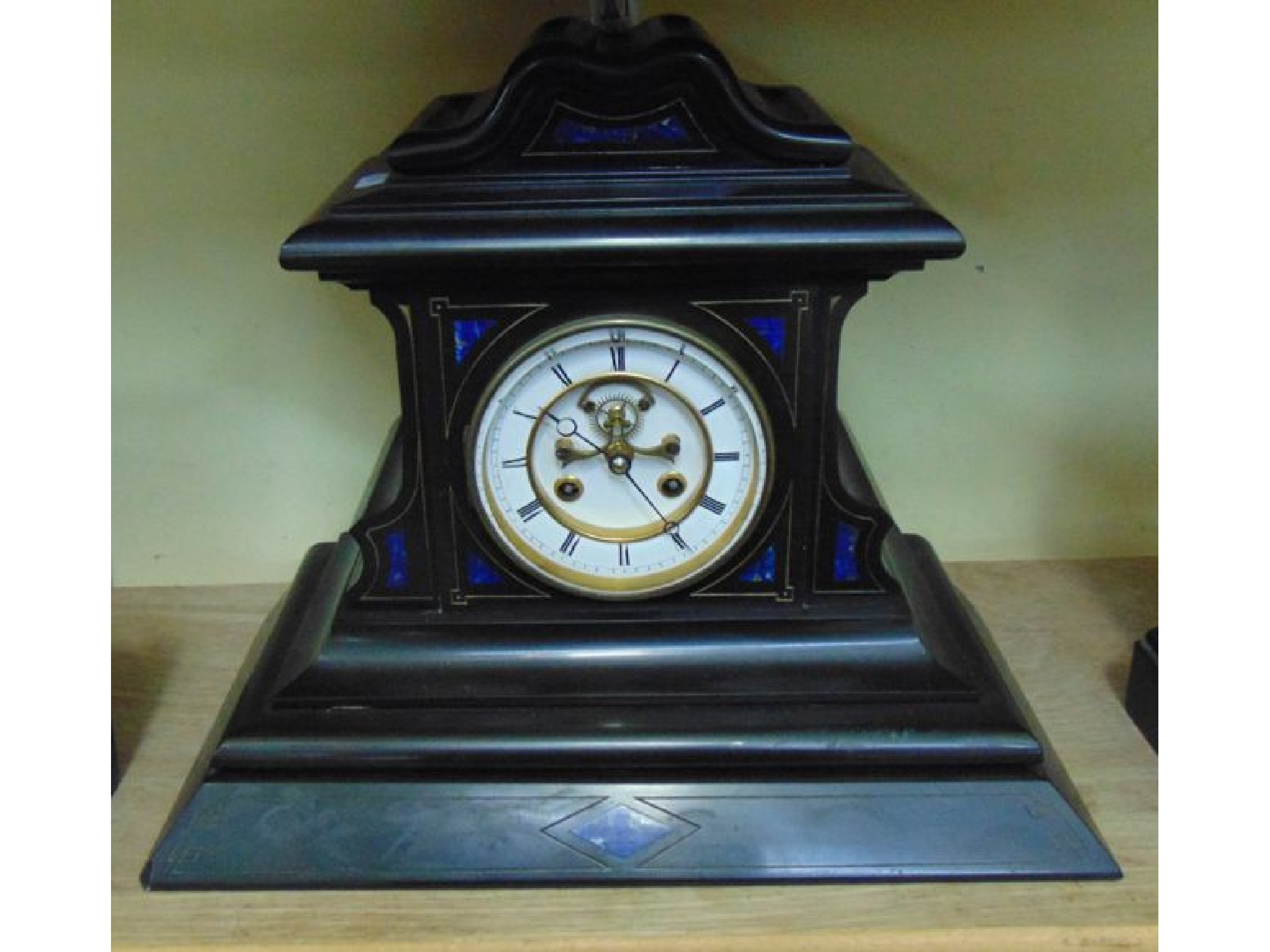 Appraisal: A substantial Victorian black marble mantle clock with inlaid stone