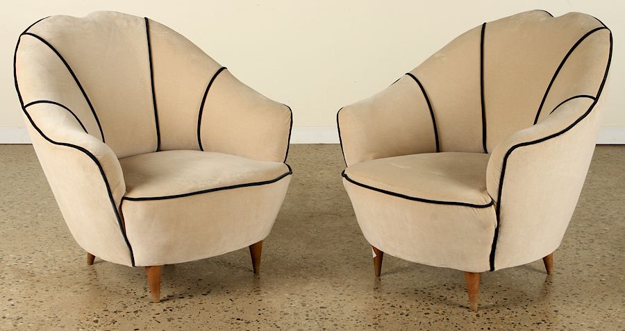 Appraisal: PAIR ITALIAN CLUB CHAIRS BY FEDERICO MUNARI C A pair