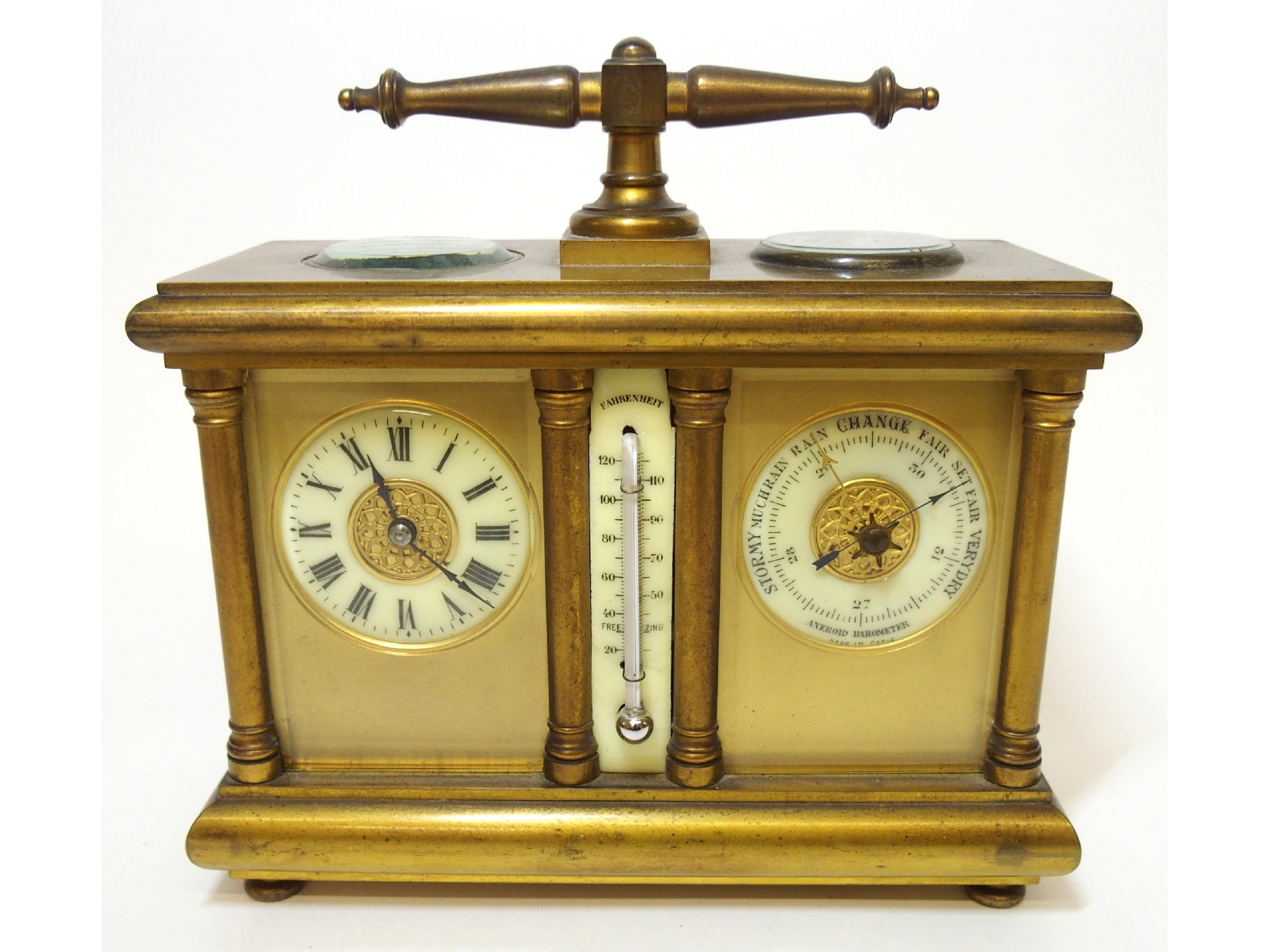 Appraisal: A Victorian brass desk clock barometer thermometer and compasswith baluster