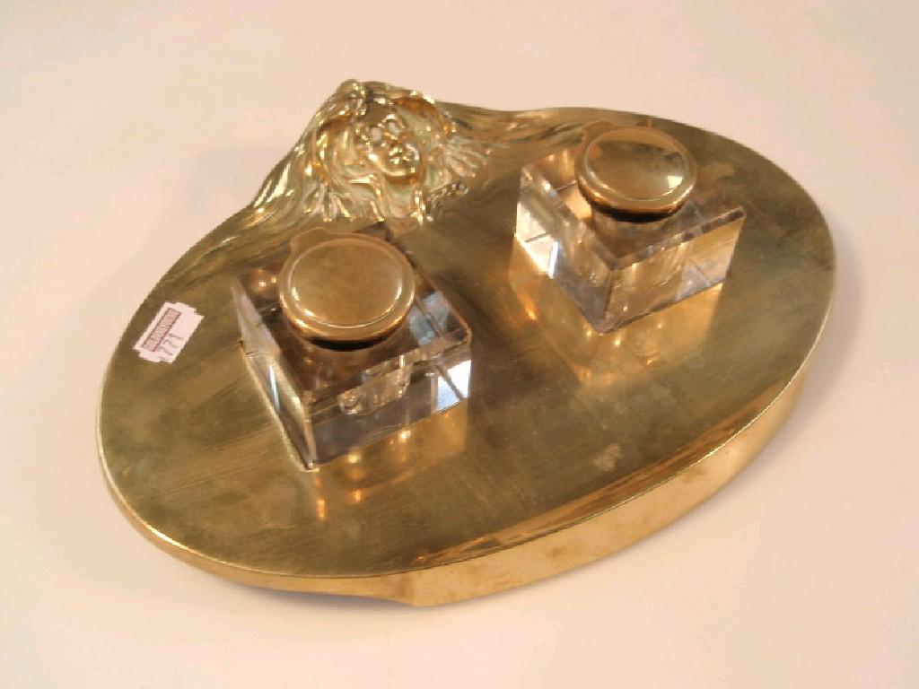 Appraisal: A French cast brass desk stand the oval stand cast