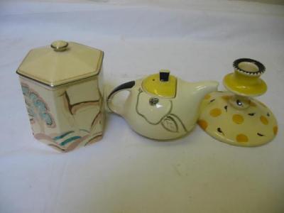 Appraisal: A SUSIE COOPER TEAPOT of globular form the yellow lid