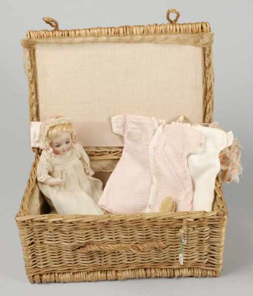 Appraisal: Darling All Bisque Baby Doll in Wicker Basket Description German