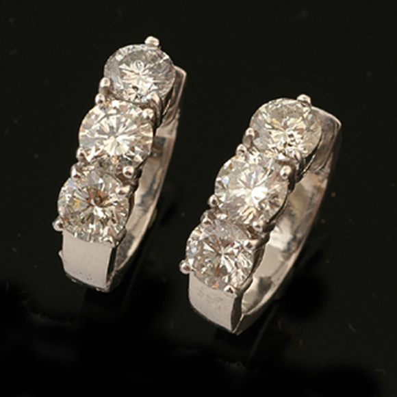 Appraisal: A pair of diamond hoop earrings Each earring set with