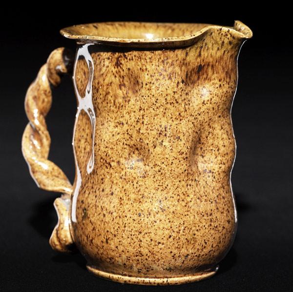 Appraisal: GEORGE OHR Pitcher with rows of dimples and a twisted