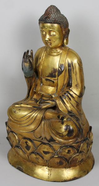 Appraisal: Wanli Period gilded bronze Buddha sitting on lotus extensive enscription