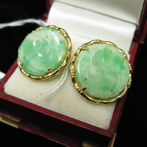 Appraisal: PAIR OF JADE AND EIGHTEEN KARAT GOLD BUTTON EARRINGS each