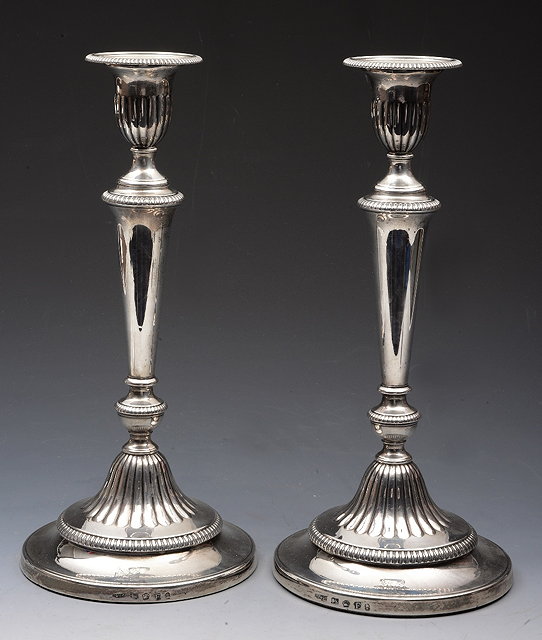 Appraisal: A PAIR OF GEORGE III SILVER CANDLESTICKS with turned and