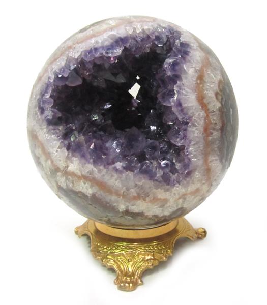 Appraisal: A LARGE AMETHYST CRYSTAL BALL ON GILT STAND A LARGE