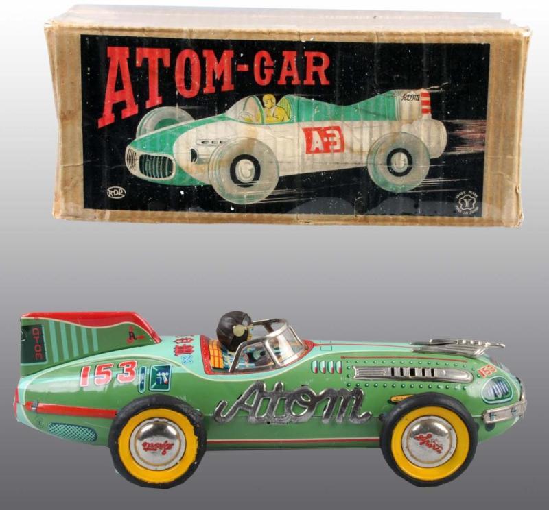 Appraisal: Tin Friction Atom Race Car Toy in Original Box Description