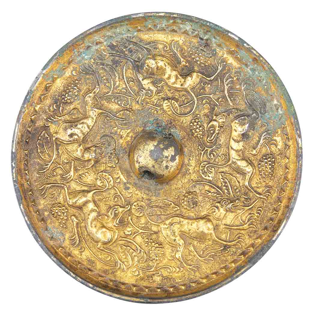 Appraisal: Chinese Gilt-Bronze Mirror Tang Dynasty Of circular form decorated on