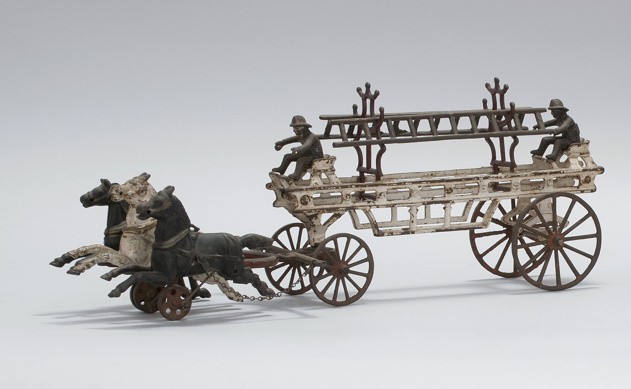 Appraisal: CAST IRON HORSE-DRAWN LADDER WAGON TOY American Circa In original