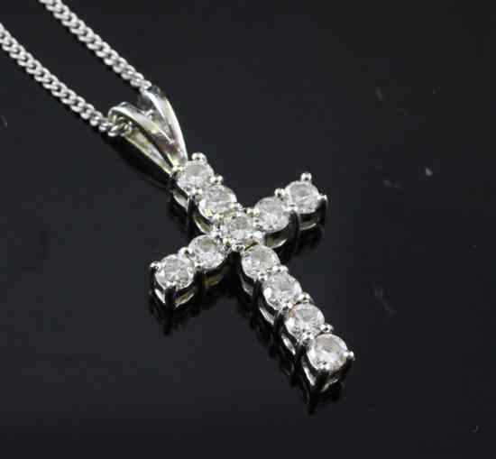 Appraisal: An ct white gold and diamond cross pendant in on