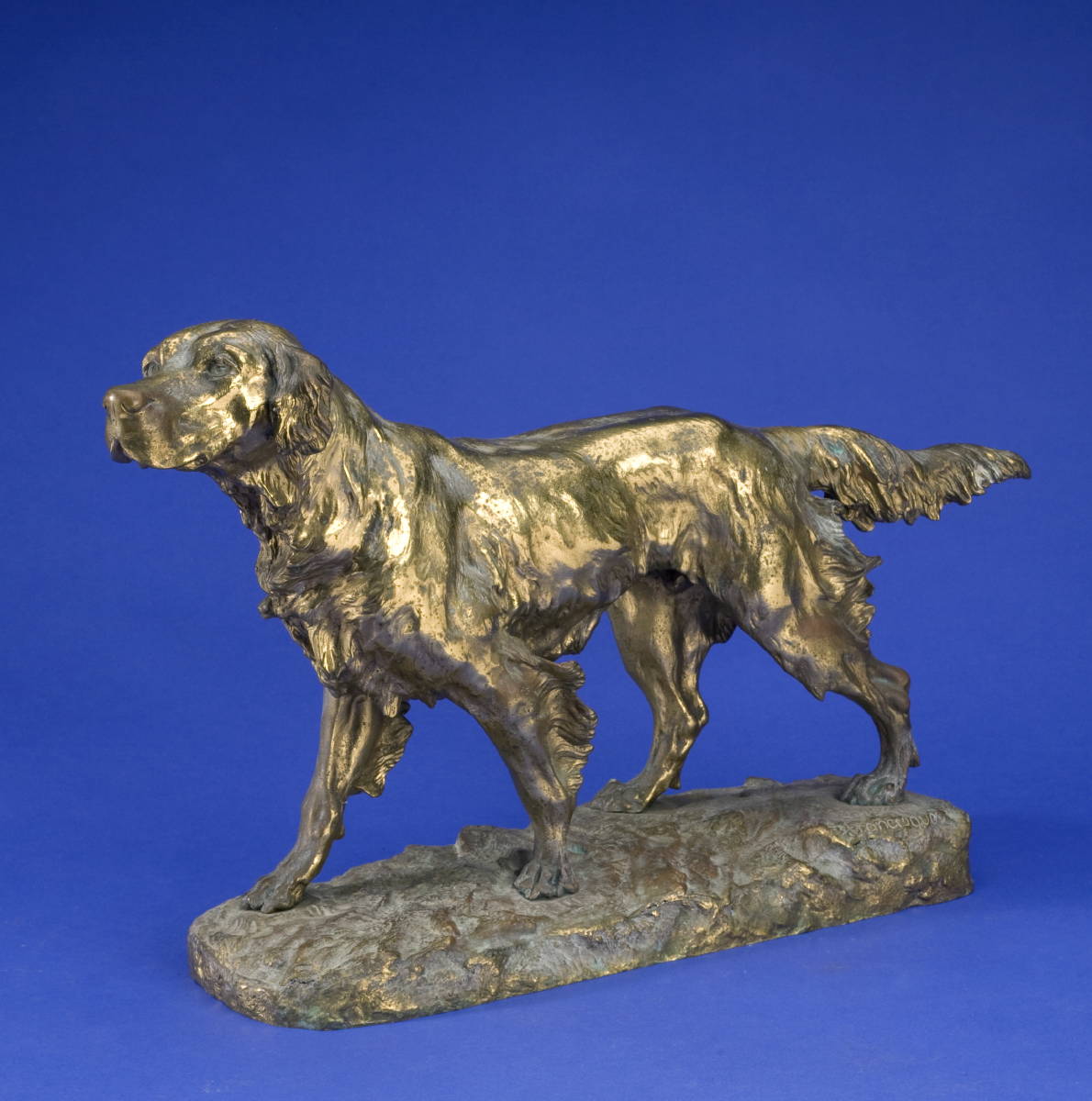 Appraisal: FRENCH GOLD-PATINATED BRONZE FIGURE OF A SETTER Depicted standing on