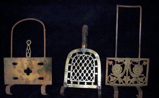 Appraisal: A th Century grate-bar trivet with pierced brass stand another