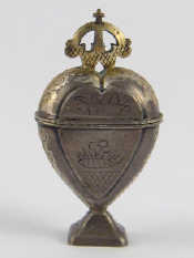 Appraisal: A Scandinavian silver plated hovedvandsaeg heart shaped amatory spice box