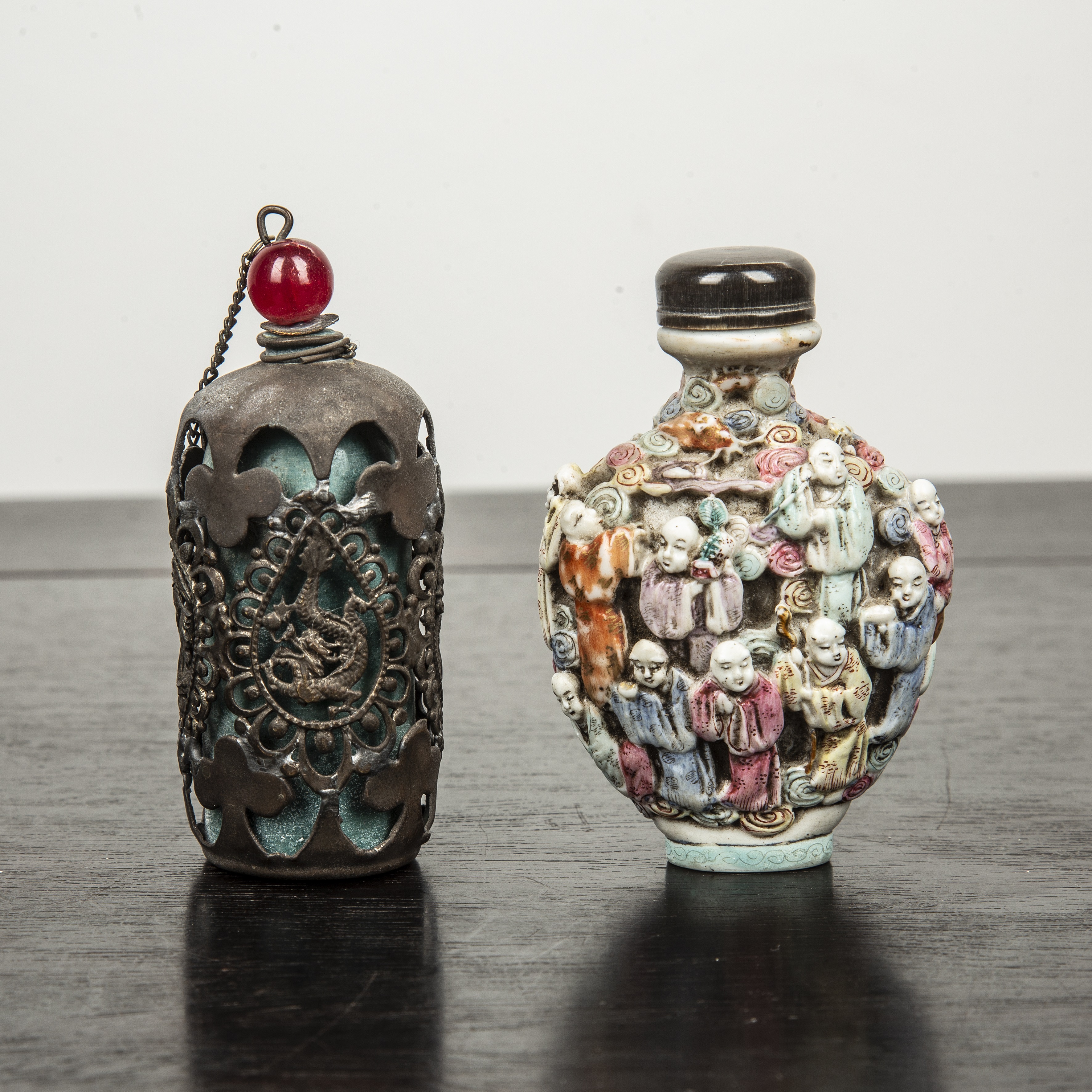 Appraisal: Two snuff bottles comprising of moulded porcelain snuff bottle decorated