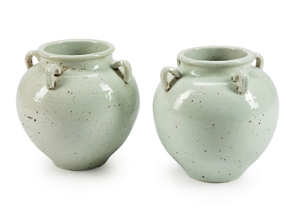 Appraisal: A Pair of Chinese White-Glazed Porcelain Urns A Pair of