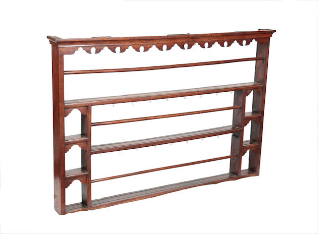 Appraisal: A George III oak plate rack The projecting cornice and