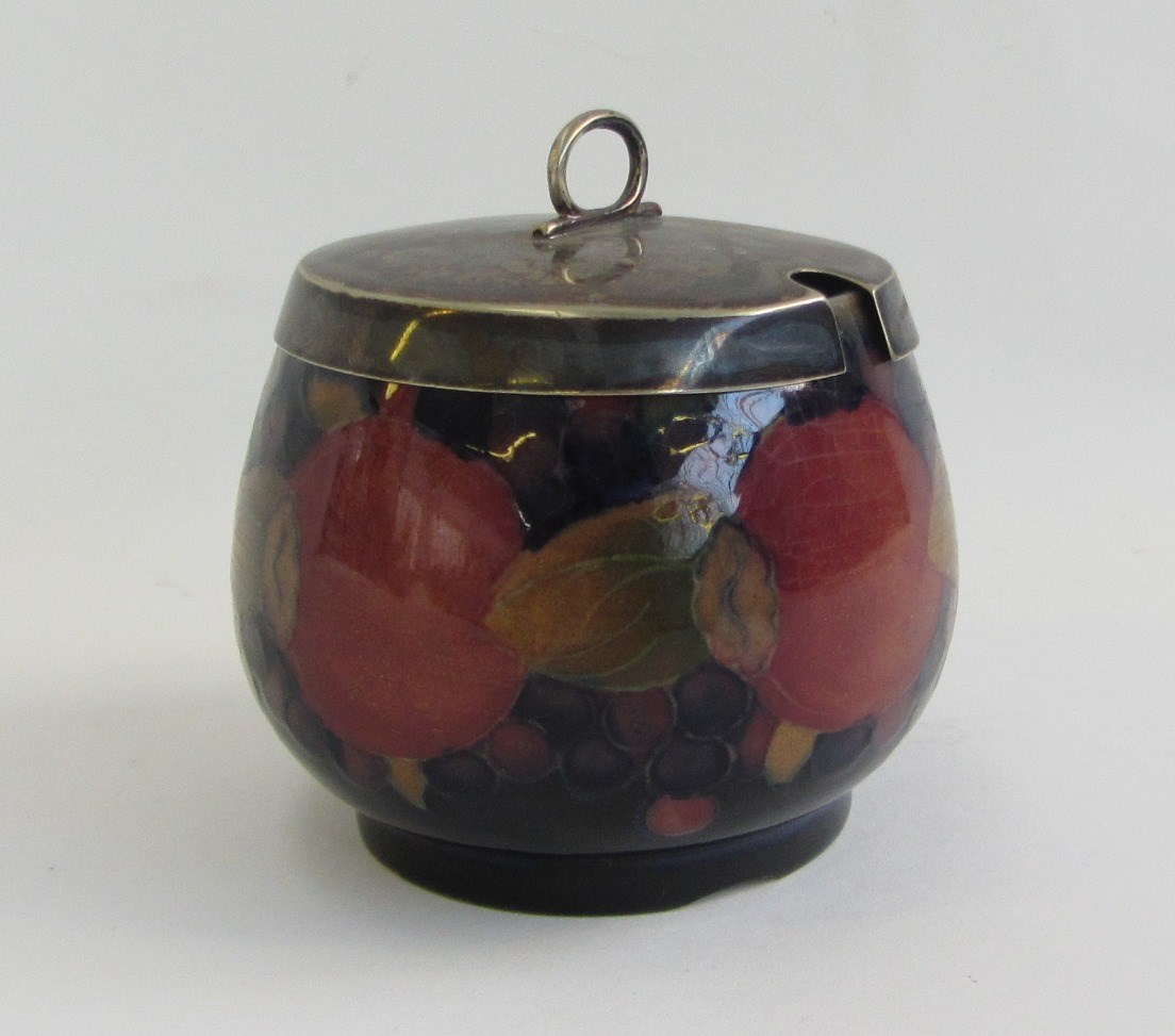 Appraisal: A Moorcroft pottery preserve jar and silver plated cover early