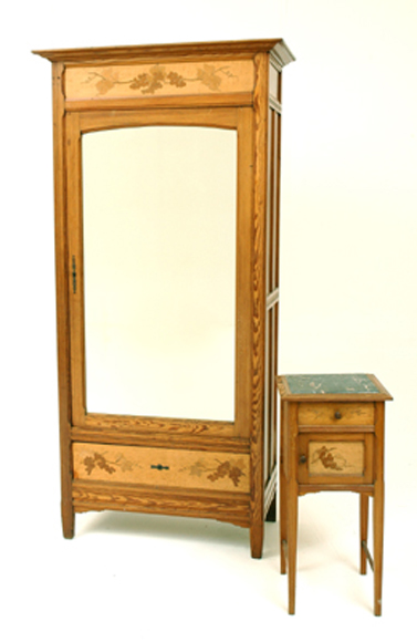 Appraisal: A FRENCH ART NOUVEAU FRUITWOOD WARDROBE AND CABINET The cabinet