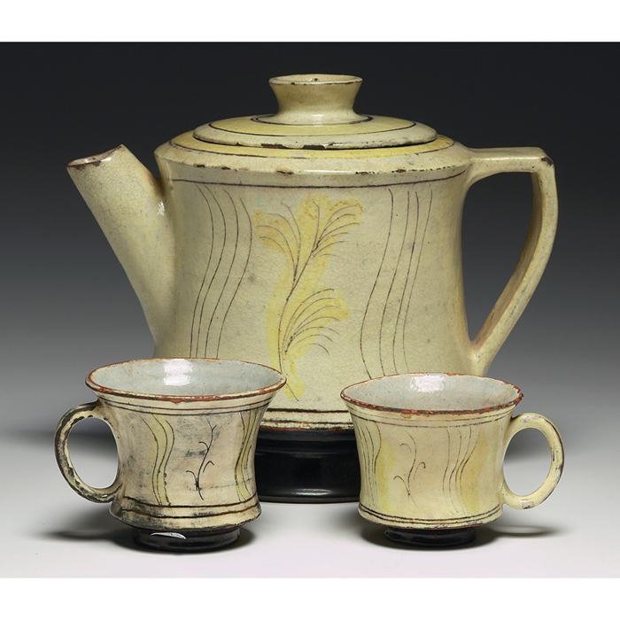 Appraisal: Henry Varnum Poor teapot and two teacups linear designs in