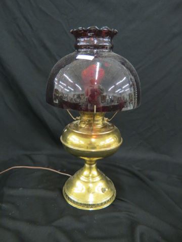 Appraisal: Antique Brass Oil Lamp with Cranberry Shade umbrella style electrified