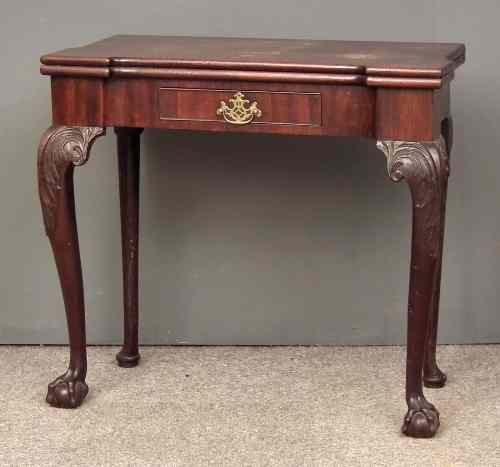 Appraisal: A George II ''Cuban'' mahogany rectangular tea table with recessed