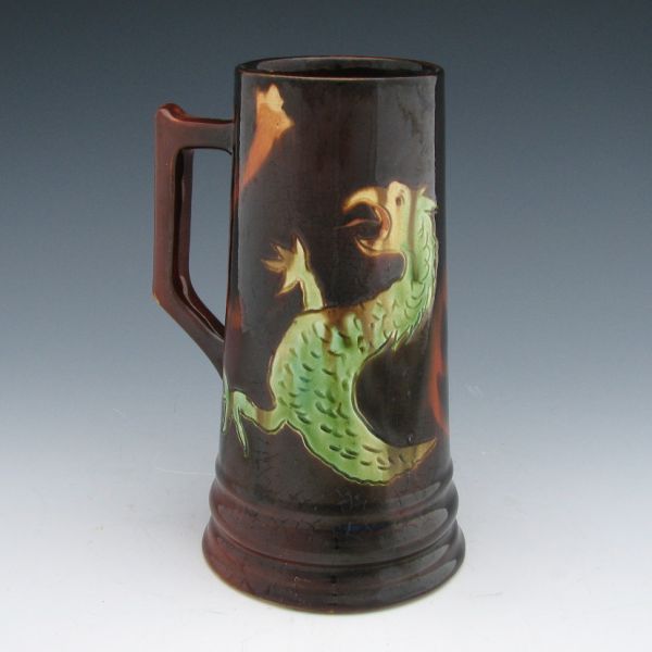 Appraisal: Owens Poster mug with incised serpent or griffin decoration Marked