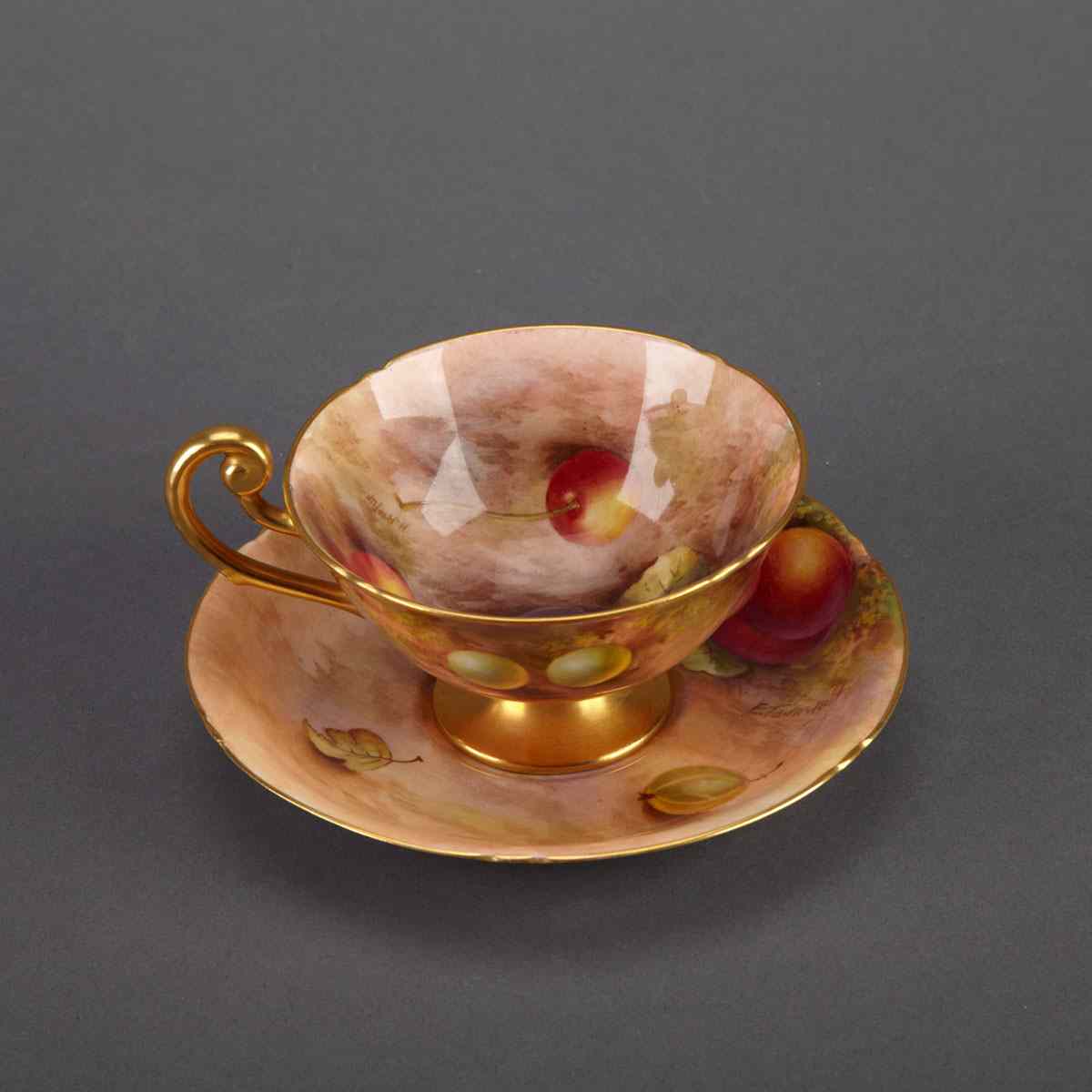 Appraisal: Royal Worcester Fruit-Painted Cup and Saucer Harry Ayrton and Edward