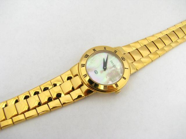 Appraisal: Gucci lady's classic gold plate wristwatch with mother of pearl