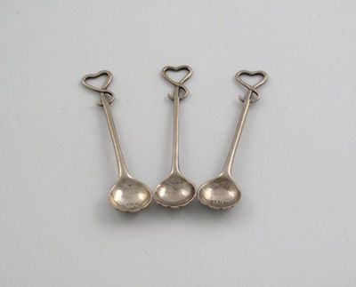 Appraisal: A matched set of three th century 'whip end' salt