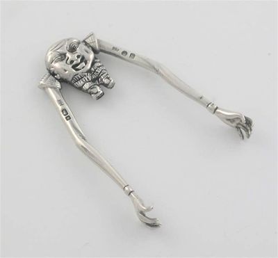 Appraisal: A pair of Victorian novelty sugar tongs in the form