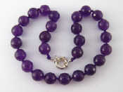 Appraisal: A faceted amethyst bead necklace approx cm long beads approx