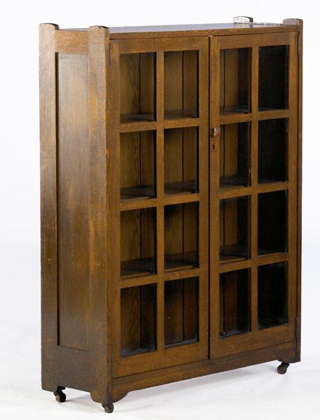 Appraisal: STICKLEY BROTHERS Two-door bookcase with three fixed shelves Unmarked numbered