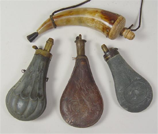 Appraisal: Four Powderhorns One of natural horn Two pewter flask One