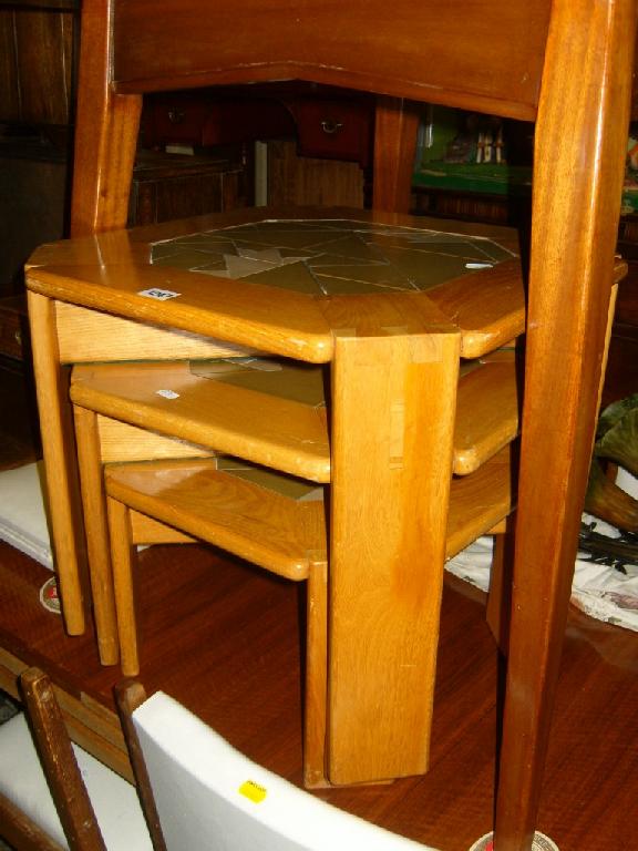 Appraisal: A nest of three Devon guild oak coffee tables with