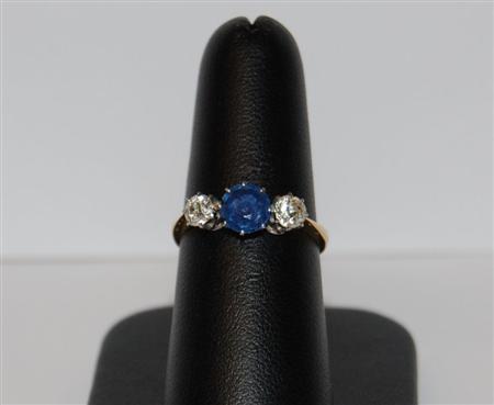 Appraisal: A late Victorian three-stone ring the central claw set circular