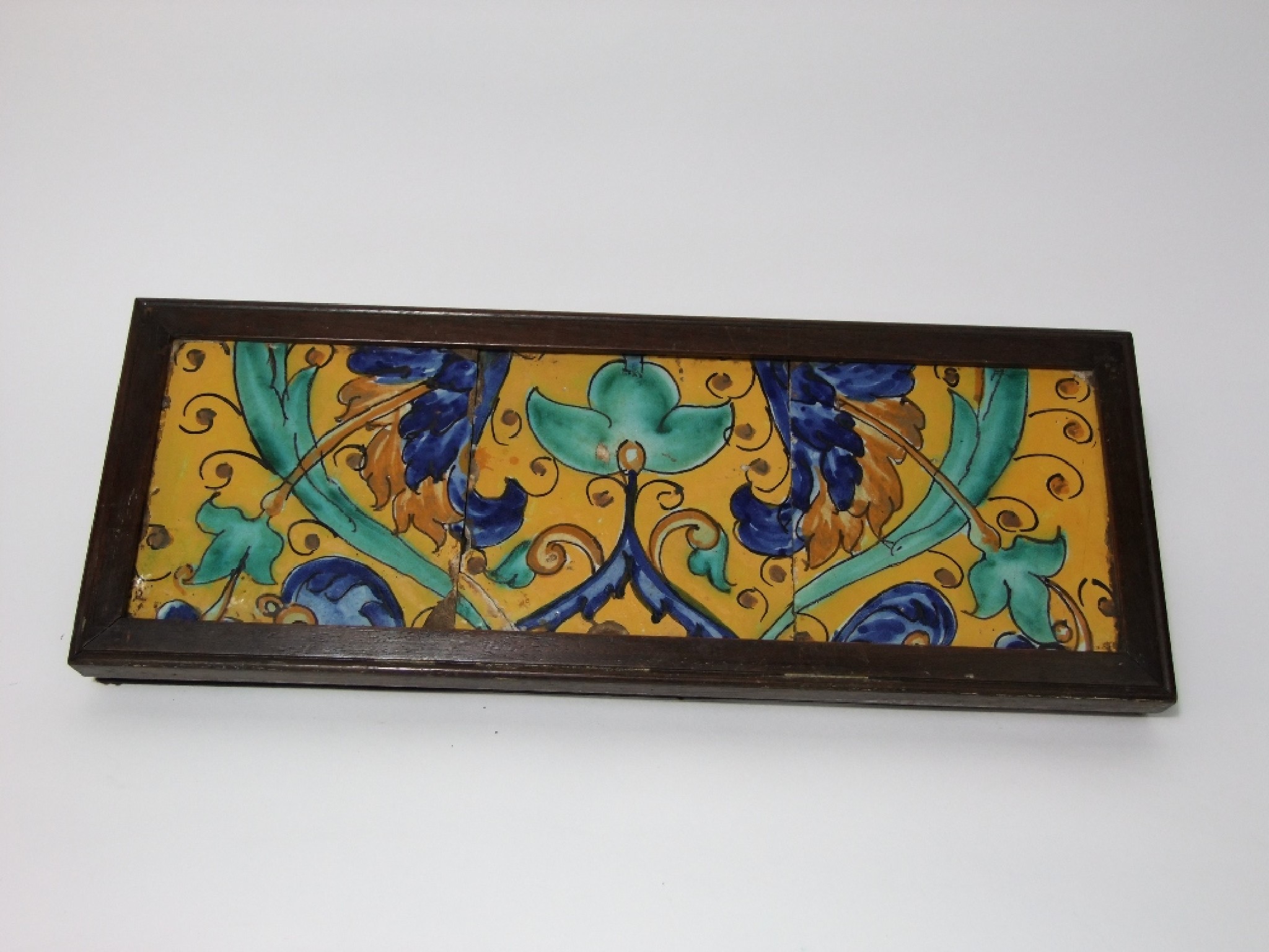 Appraisal: A frieze of three early hand painted spanish tiles from