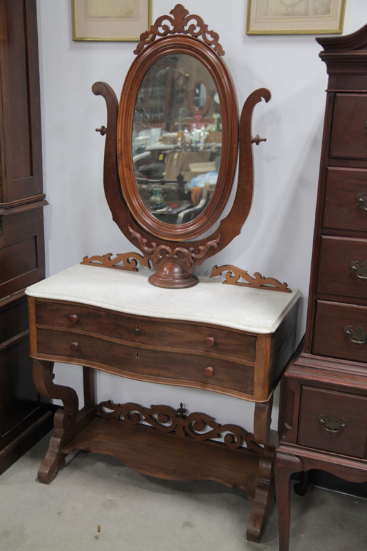 Appraisal: VICTORIAN DRESSING TABLE Walnut having a wishbone mirror serpentine front