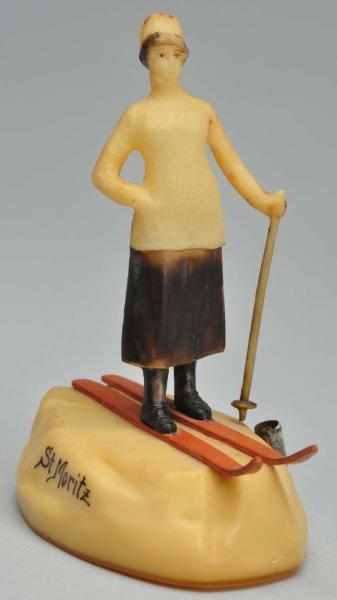 Appraisal: Lady Skier Figural Tape Measure Description German Thick celluloid Scrolled