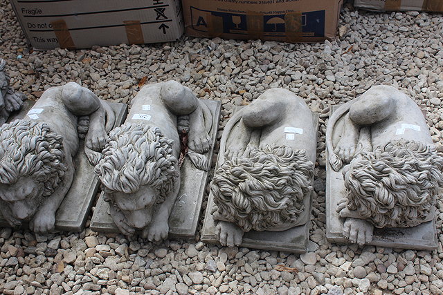 Appraisal: THREE PAIRS OF CONCRETE LION STATUES each cm in length