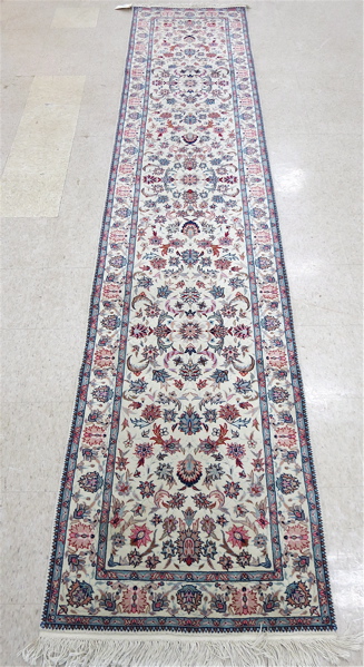 Appraisal: HAND KNOTTED ORIENTAL RUNNER Indo-Persian overall floral design on cream