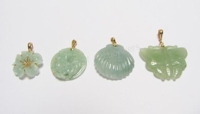 Appraisal: Four jade pendants all with K yellow gold embellishments including