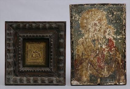 Appraisal: RUSSIAN GILT-METAL ICON AND A PAINTED ICON The first relief