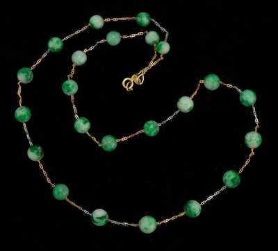 Appraisal: A Carved Jadeite Bead Necklace k yellow gold chain set