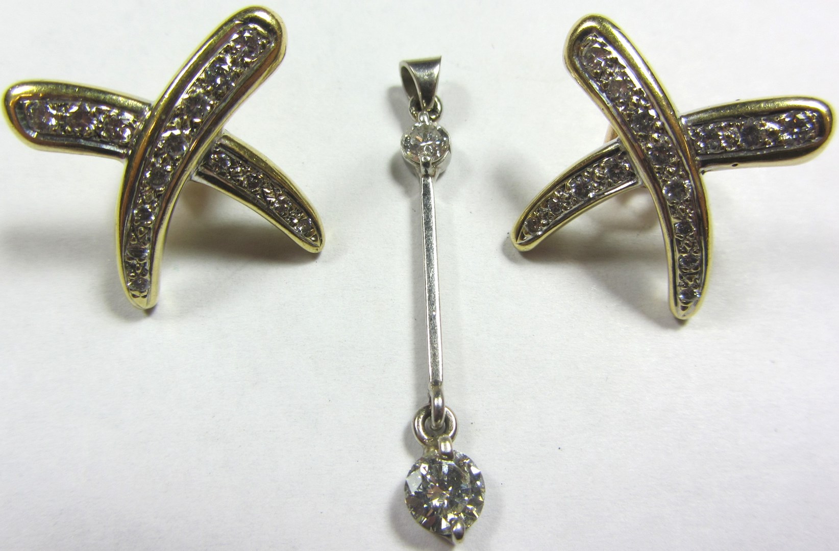 Appraisal: A diamond two stone drop pendant and a pair of