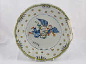 Appraisal: An th century French tin glazed ceramic plate probably Quimper