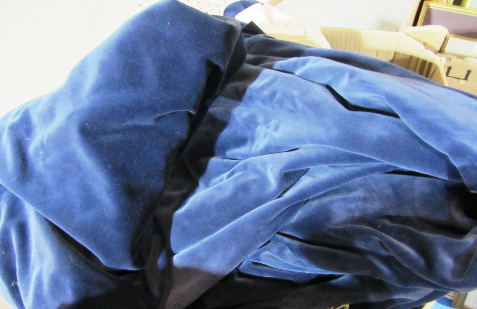 Appraisal: Three pairs of blue velvet curtains with tie backs and